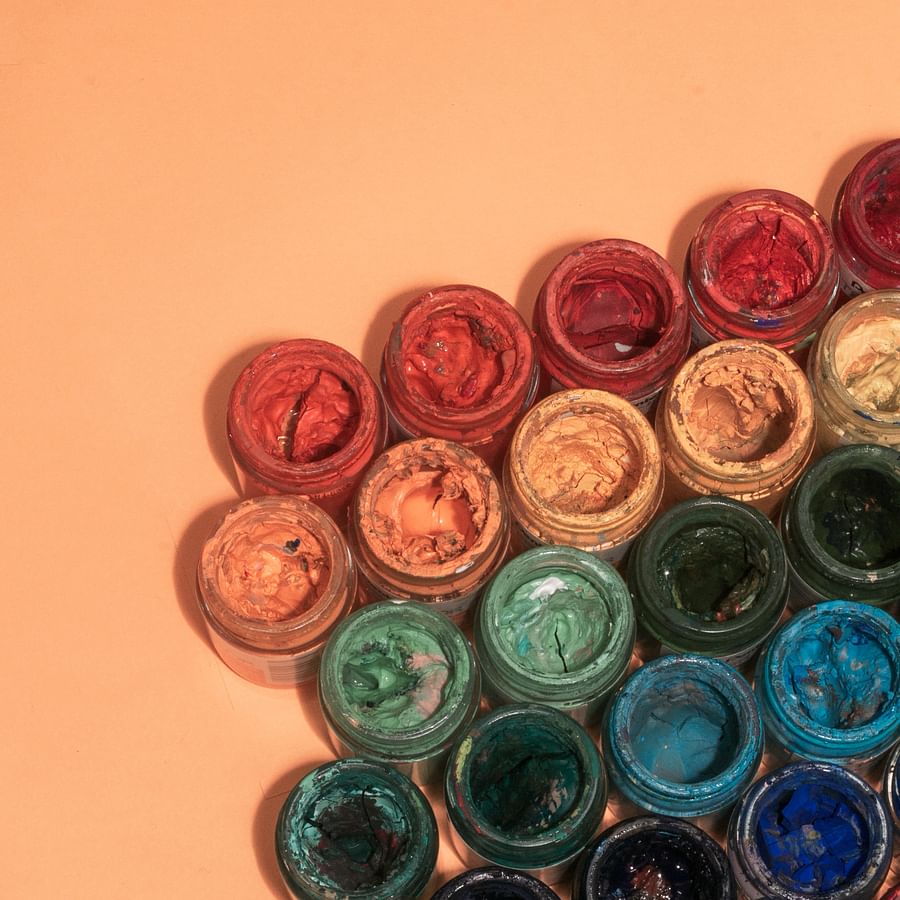Colorful containers with blooming perennial flowers in a patio setting