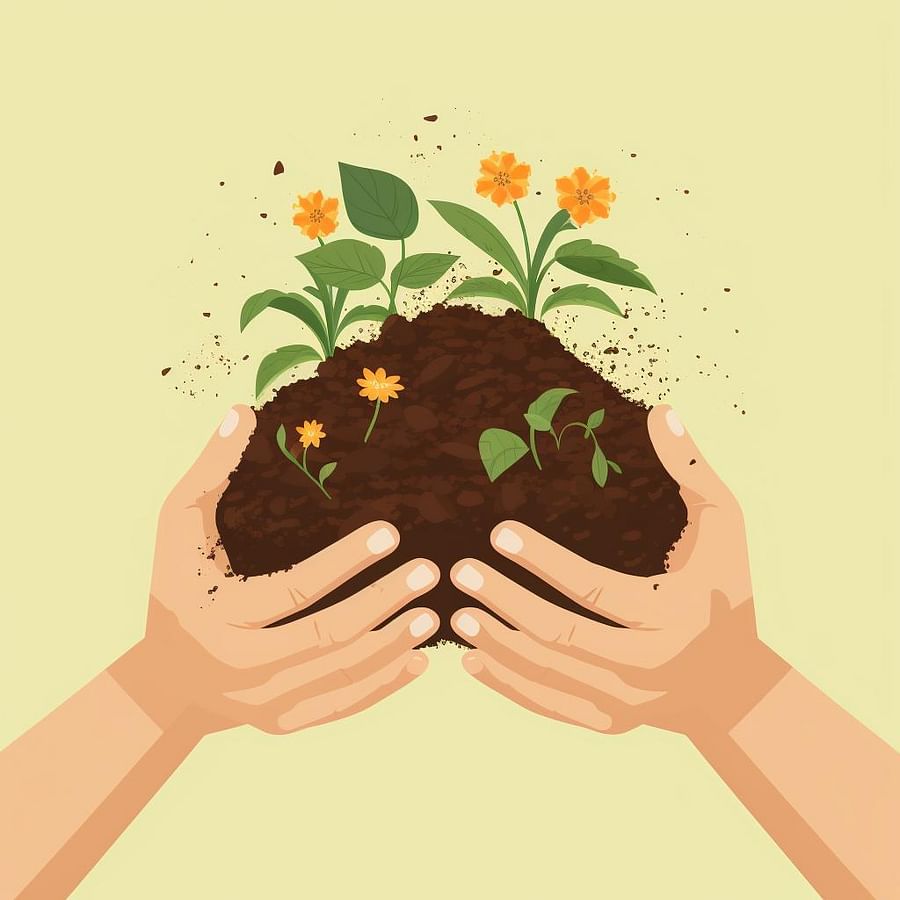 Hands mixing compost into garden soil